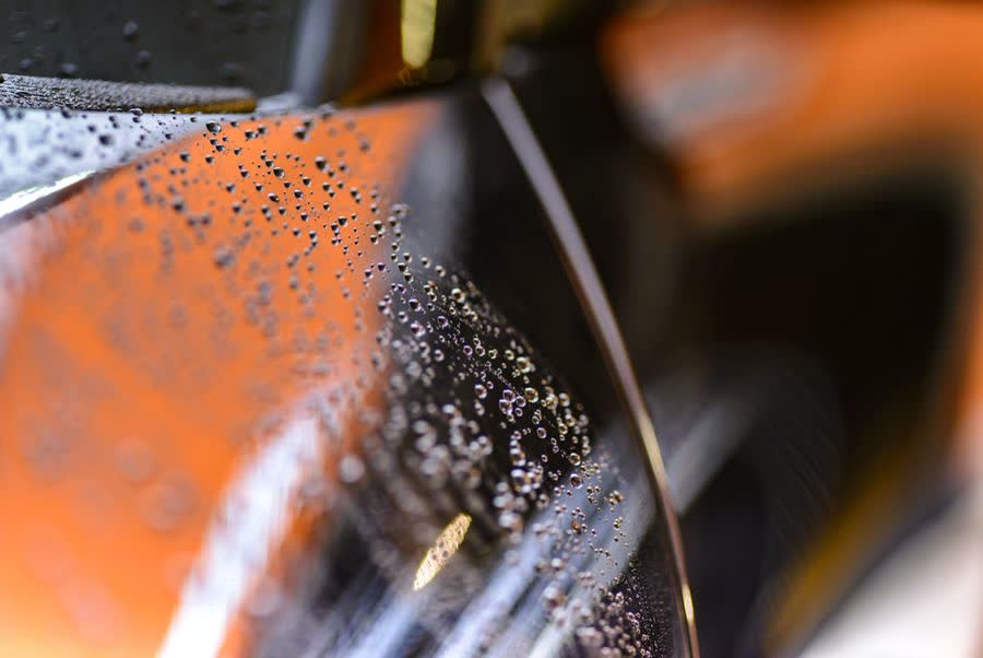 Water beading on a ceramic-coated car surface