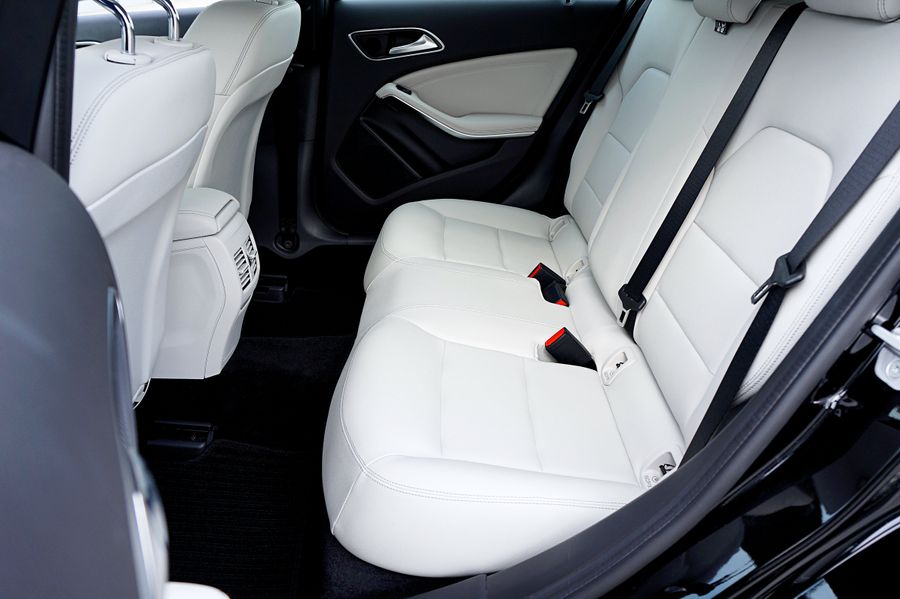 Clean light leather rear seats inside a car